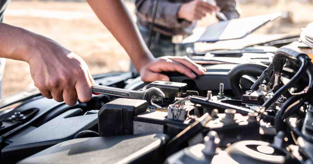 Mechanic Fixing Car Engine