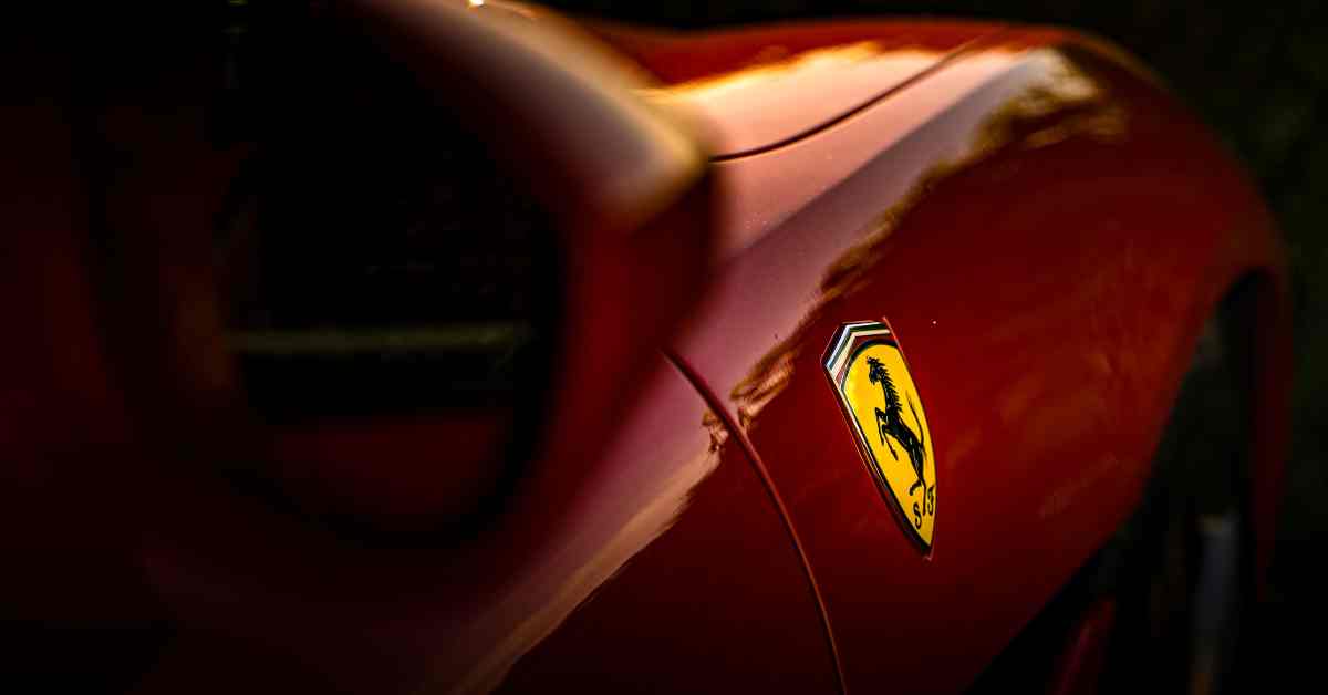 Selective Focus Photo of Ferrari Emblem